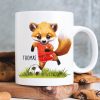 Bedruckte Tasse Becher Fuchs Fussballfan personalisiert mit Wunschname, Geschenk Geburtstag Auf dem Bild ist das Produkt: Bedruckte Tasse Becher Fuchs Fussballfan personalisiert mit Wunschname, Geschenk Geburtstag zum Preis von €17.90 abgebildet.