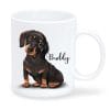 Auf dem Bild ist das Produkt: Keramiktasse bedruckt Hund Dackel mit Wunschnamen Kaffeetasse personalisiert Geschenk Geburtstag 330 ml zum Preis von €18.9 abgebildet.