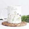 Auf dem Bild ist das Produkt: Tasse bedruckt mit Wildblumen Gräsern und dem Wunschnamen Kaffeetasse, personalisiert, Geschenk Geburtstag beste Freundin zum Preis von €18.9 abgebildet.
