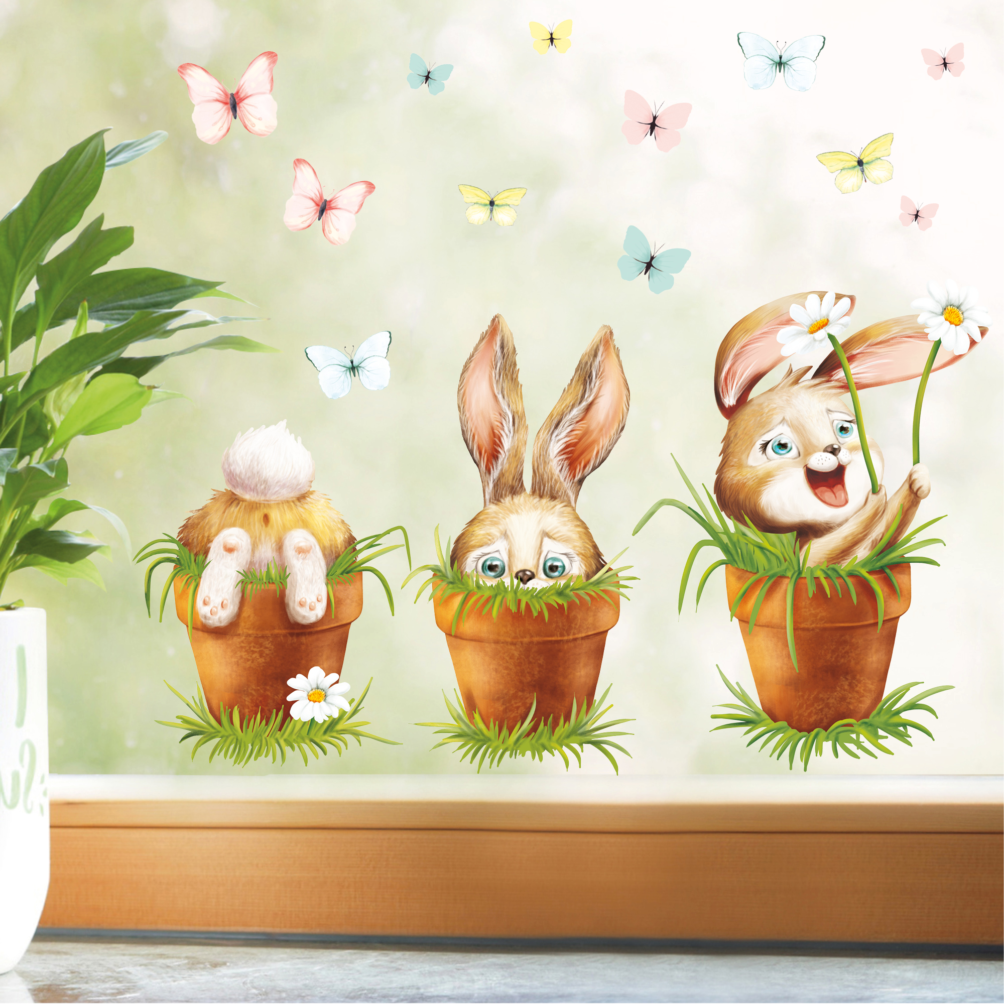 Auf dem Bild ist das Produkt: Fensterbild Frühling Ostern 3 Hasen im Blumentopf mit Schmetterlingen Fensterdeko Kinderzimmer Kind Frühlingsdeko zum Preis von €13.90 abgebildet.