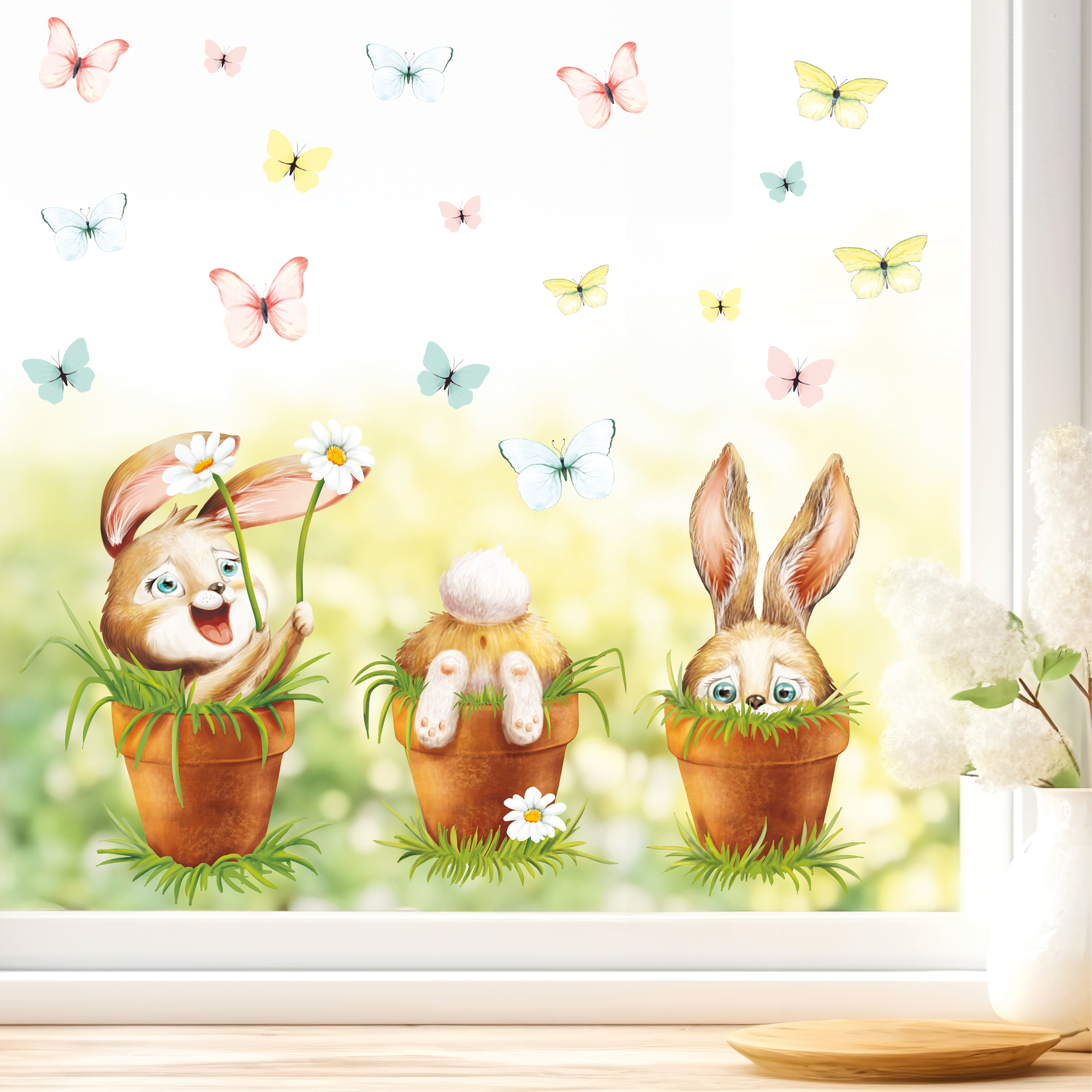Auf dem Bild ist das Produkt: Fensterbild Frühling Ostern 3 Hasen im Blumentopf mit Schmetterlingen Fensterdeko Kinderzimmer Kind Frühlingsdeko zum Preis von €13.90 abgebildet.