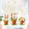 Auf dem Bild ist das Produkt: Fensterbild Frühling Ostern 3 Hasen im Blumentopf mit Schmetterlingen Fensterdeko Kinderzimmer Kind Frühlingsdeko zum Preis von €13.90 abgebildet.