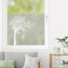 Auf dem Bild ist das Produkt: Sichtschutzfolie mit einem Baum und einem Käfig, Fensterfolie, Fensterdeko Milchglasfolie zum Preis von €24.9 abgebildet.