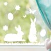 Fensteraufkleber Hasen mit Ostereiern und Schmetterlingen WIEDERVERWENDBAR Auf dem Bild ist das Produkt: Fensteraufkleber Hasen mit Ostereiern und Schmetterlingen WIEDERVERWENDBAR zum Preis von €12.90 abgebildet.