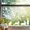Fensteraufkleber Hasen mit Ostereiern und Schmetterlingen WIEDERVERWENDBAR Auf dem Bild ist das Produkt: Fensteraufkleber Hasen mit Ostereiern und Schmetterlingen WIEDERVERWENDBAR zum Preis von €12.90 abgebildet.