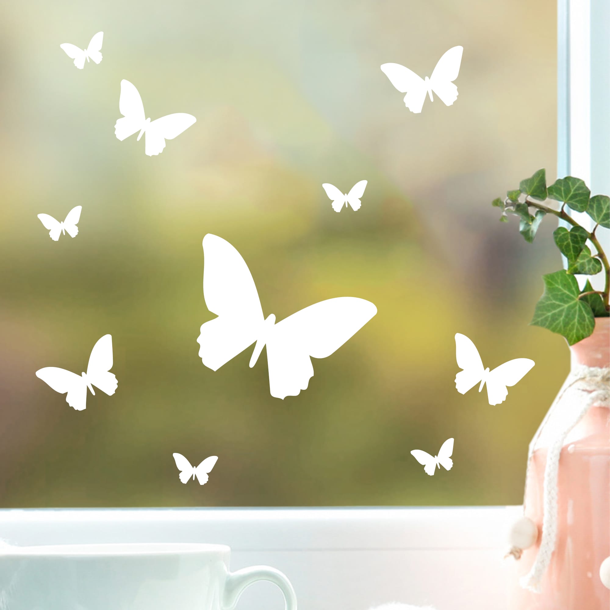 Auf dem Bild ist das Produkt: Fensteraufkleber Frühling Schmetterlinge weiß WIEDERVERWENDBAR zum Preis von €8.9 abgebildet.